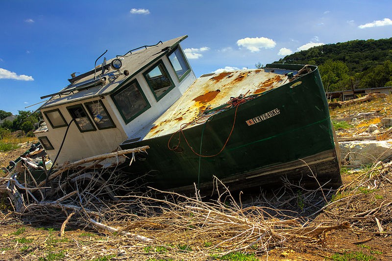 The 2011 drought dried up most of Central Texas water ways. This boat was left to sit in the middle of what is normally a branch of Lake Travis, part of the Colorado River.